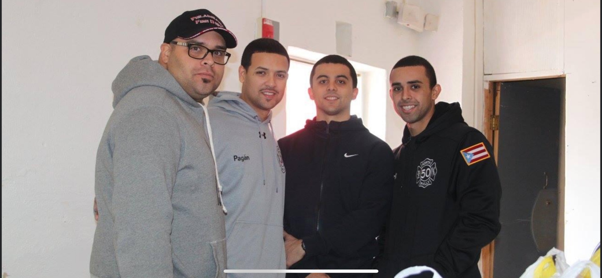 Four SAPFA members posing together during a community outreach event