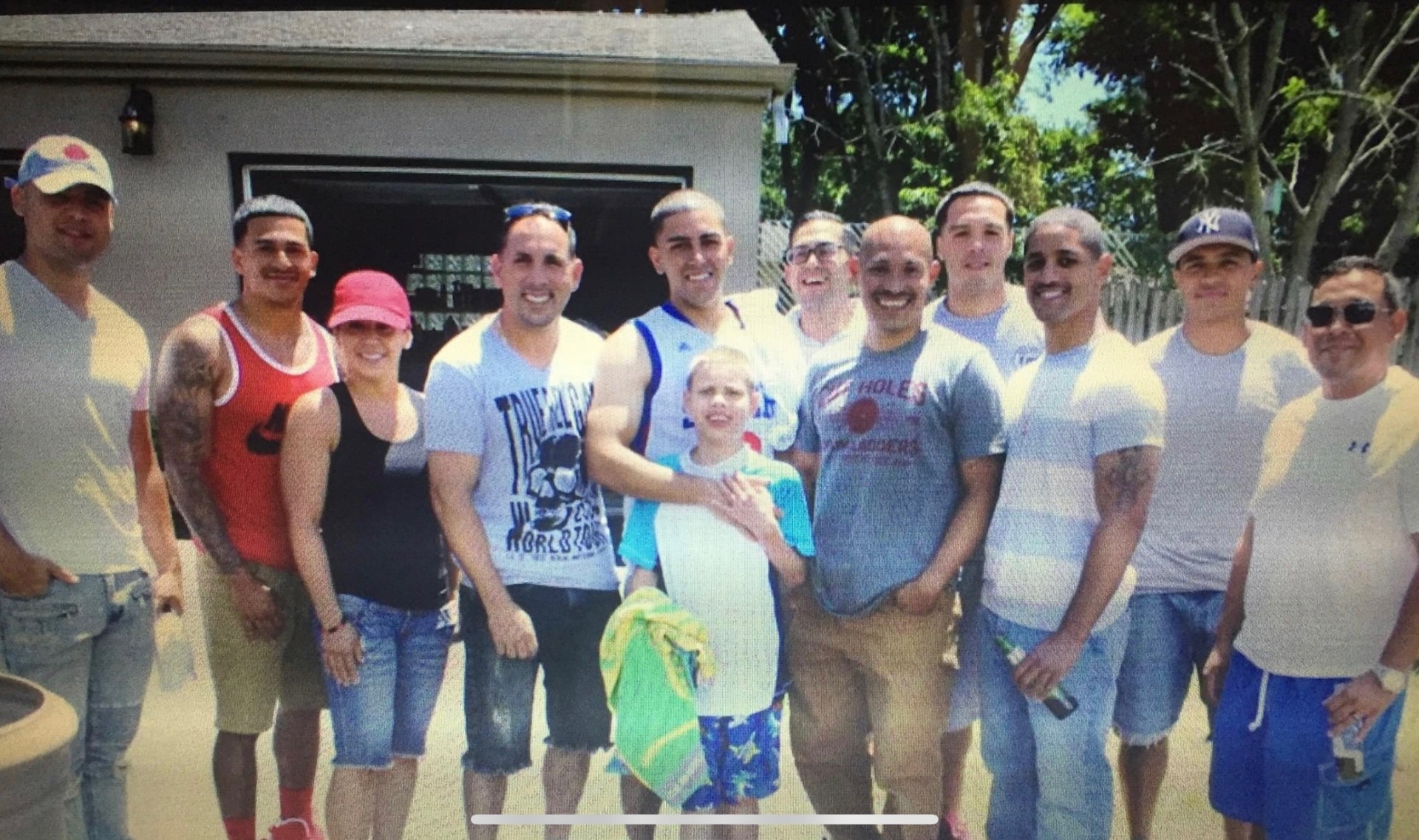 Group of SAPFA members and family members posing together on a summer afternoon